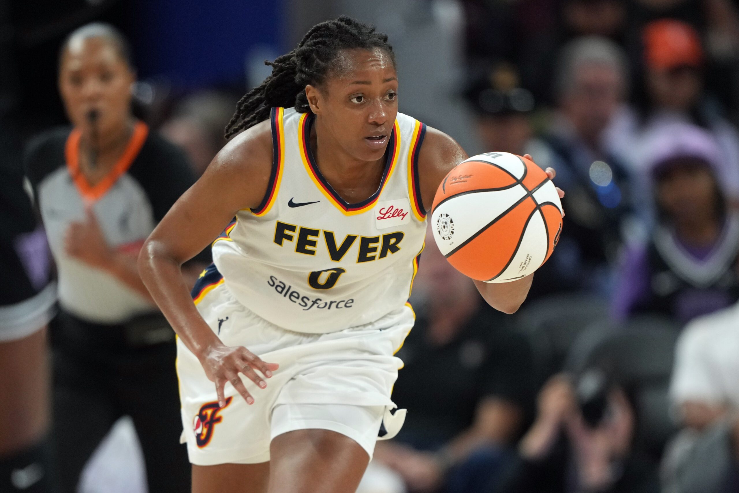 Aug 31, 2025; San Francisco, California, USA; Indiana Fever guard Kelsey Mitchell (0) dribbles against the Golden State Valkyries during the third quarter at Chase Center. Mandatory Credit: Darren Yamashita-Imagn Images