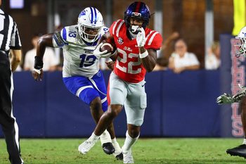 Aug 30, 2025; Oxford, Mississippi, USA; Mississippi Rebels running back Logan Diggs (22) runs the ball during the fourth quarter against the Georgia State Panthers at Vaught-Hemingway Stadium. Mandatory Credit: Petre Thomas-Imagn Images