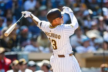Sep 3, 2025; San Diego, California, USA; San Diego Padres third baseman Manny Machado (13) hits a two-run home run during the sixth inning against the Baltimore Orioles at Petco Park. Mandatory Credit: David Frerker-Imagn Images