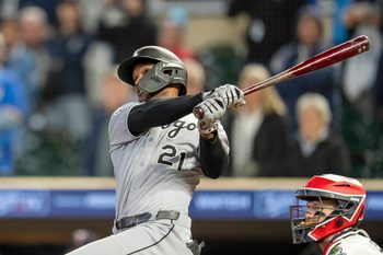 Sep 3, 2025; Minneapolis, Minnesota, USA; Chicago White Sox center fielder Michael A. Taylor (21) hits a two run double against the Minnesota Twins in the ninth inning at Target Field. Mandatory Credit: Jesse Johnson-Imagn Images