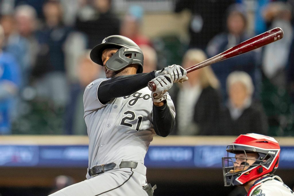 Sep 3, 2025; Minneapolis, Minnesota, USA; Chicago White Sox center fielder Michael A. Taylor (21) hits a two run double against the Minnesota Twins in the ninth inning at Target Field. Mandatory Credit: Jesse Johnson-Imagn Images