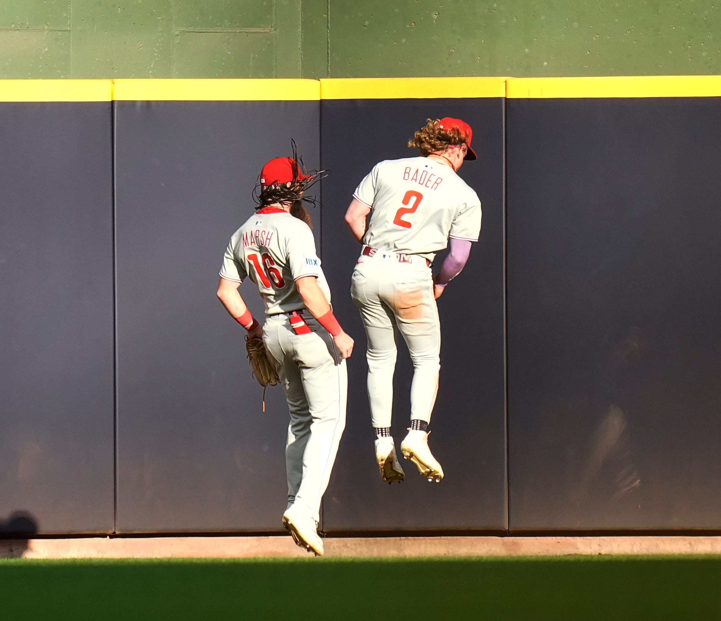 Philadelphia Phillies left fielder Brandon Marsh (16) and Philadelphia Phillies center fielder Harrison Bader (2) celebrate the catch after Milwaukee Brewers second base Andruw Monasterio (14) flies out sharply to center field during the ninth inning of the game on Thursday September 4, 2025 at American Family Field in Milwaukee, Wisconsin.