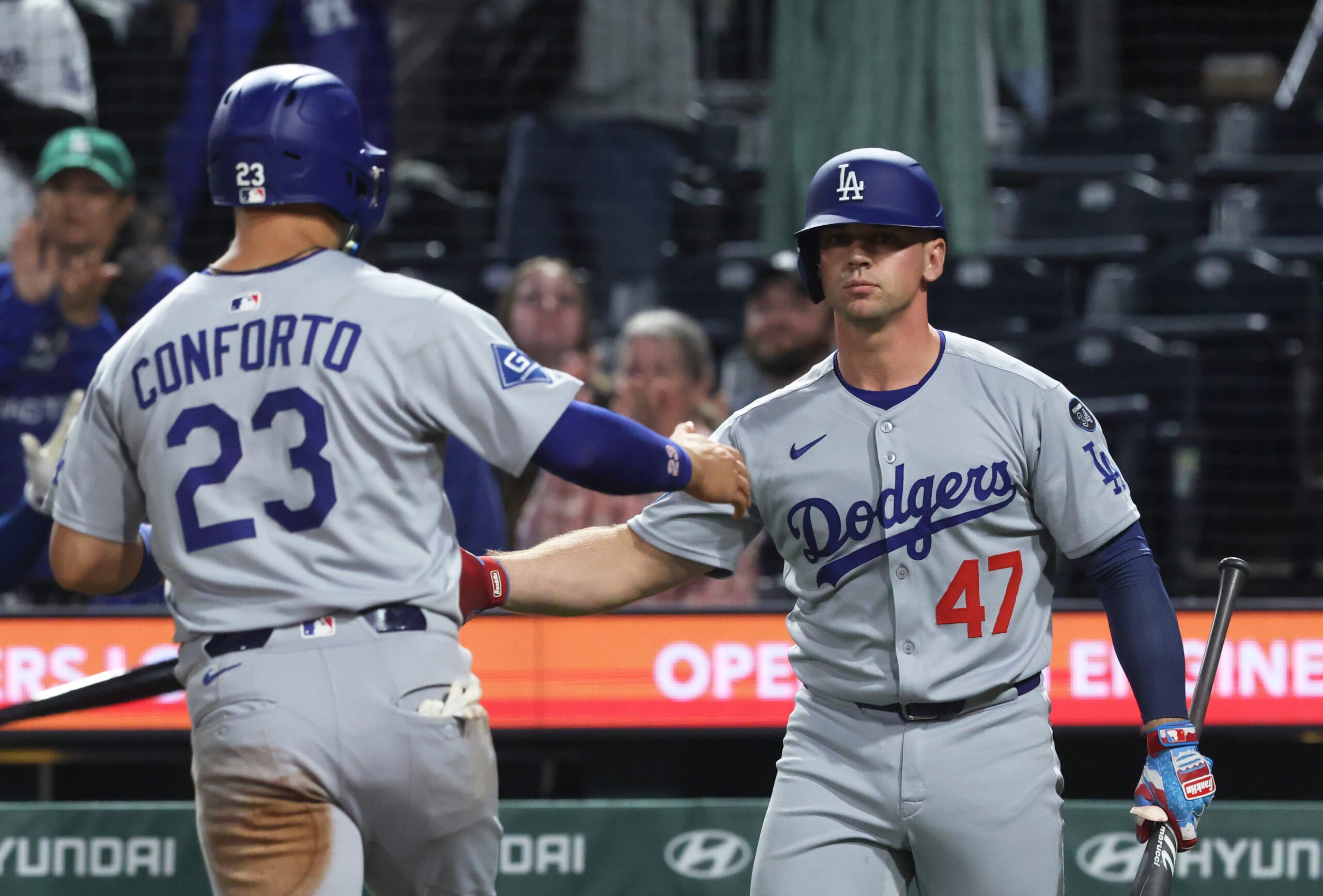 Sep 4, 2025; Pittsburgh, Pennsylvania, USA;  Los Angeles Dodgers catcher Ben Rortvedt (47) congratulates left fielder Michael Conforto (23) crossing home plate to score a run against the Pittsburgh Pirates at PNC Park. Mandatory Credit: Charles LeClaire-Imagn Images