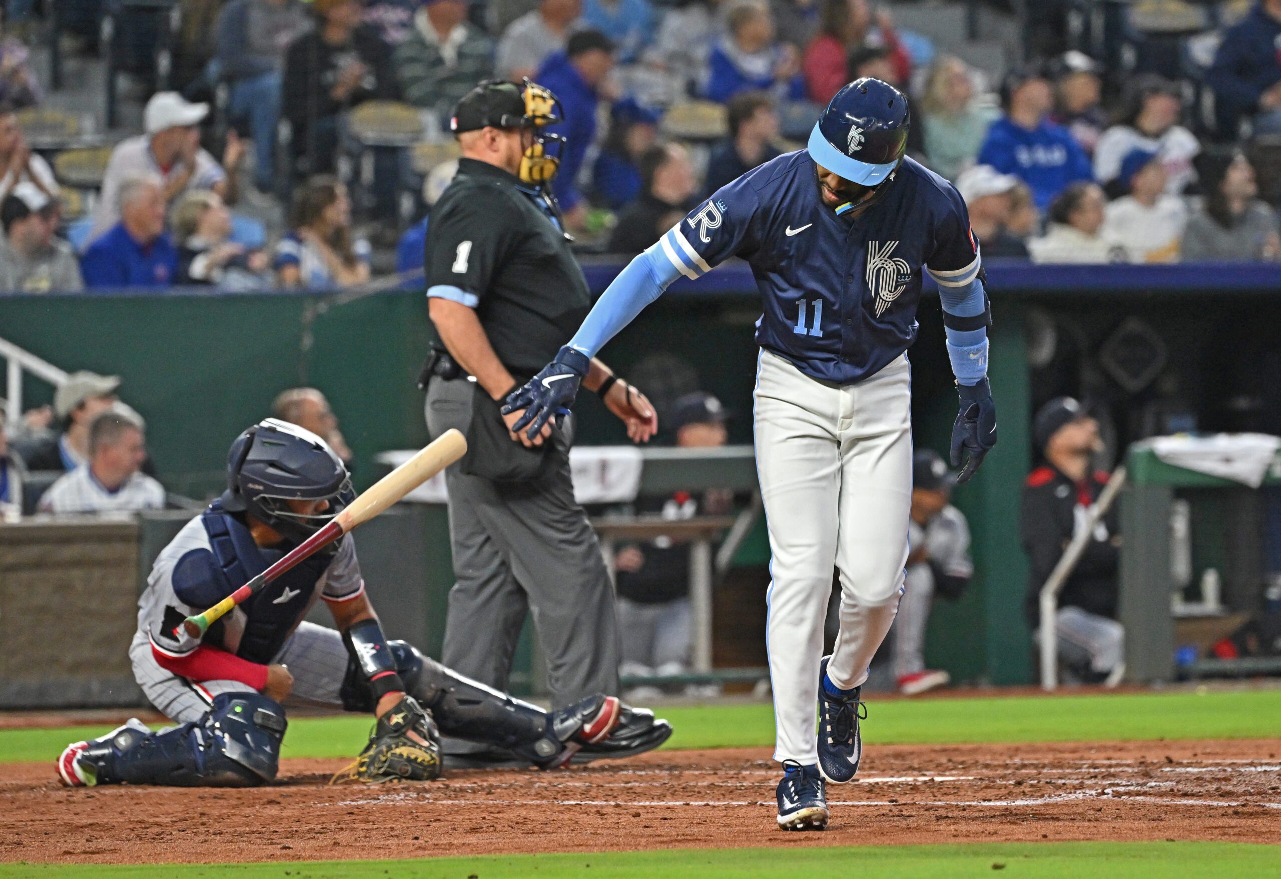 Sep 5, 2025; Kansas City, Missouri, USA;  Kansas City Royals third baseman Maikel Garcia (11) throws his bat to the ground after hitting a two-run home run in the third inning against the Minnesota Twins at Kauffman Stadium. Mandatory Credit: Peter Aiken-Imagn Images