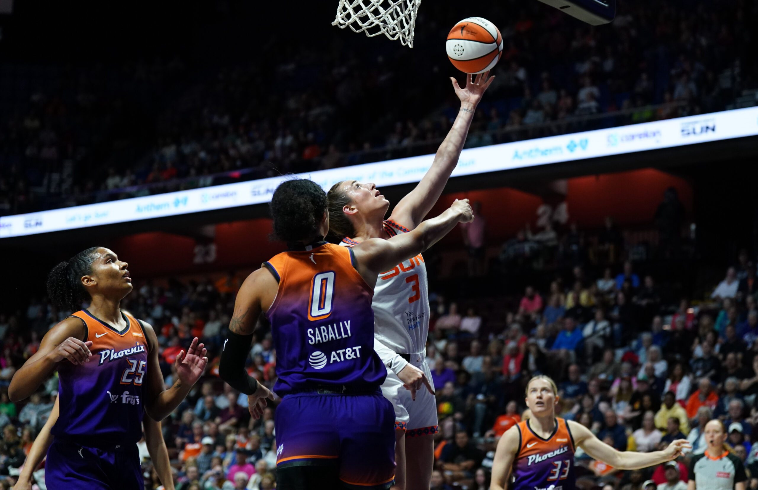 Sep 6, 2025; Uncasville, Connecticut, USA; Connecticut Sun guard Marina Mabrey (3) scores against Phoenix Mercury forward Satou Sabally (0) in the first half at Mohegan Sun Arena. Mandatory Credit: David Butler II-Imagn Images