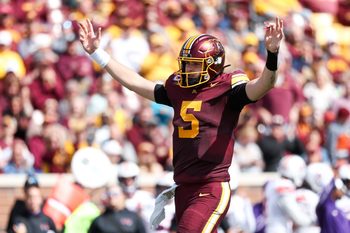 Sep 6, 2025; Minneapolis, Minnesota, USA; Minnesota Golden Gophers quarterback Drake Lindsey (5) celebrates running back Cam Davis's (23) touchdown against the Northwestern State Demons during the second quarter at Huntington Bank Stadium. Mandatory Credit: Matt Krohn-Imagn Images