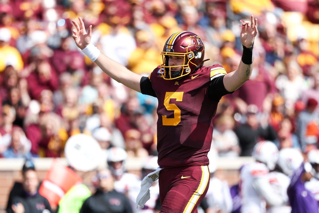 Sep 6, 2025; Minneapolis, Minnesota, USA; Minnesota Golden Gophers quarterback Drake Lindsey (5) celebrates running back Cam Davis's (23) touchdown against the Northwestern State Demons during the second quarter at Huntington Bank Stadium. Mandatory Credit: Matt Krohn-Imagn Images