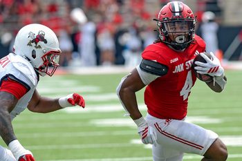 Jacksonville StateÕs Cam Cook scores a touchdown as LibertyÕs Deuce Spurlock defends during college school football action at AmFirst Stadium in Jacksonville, Alabama September 6, 2025. (Dave Hyatt / Hyatt Media LLC)