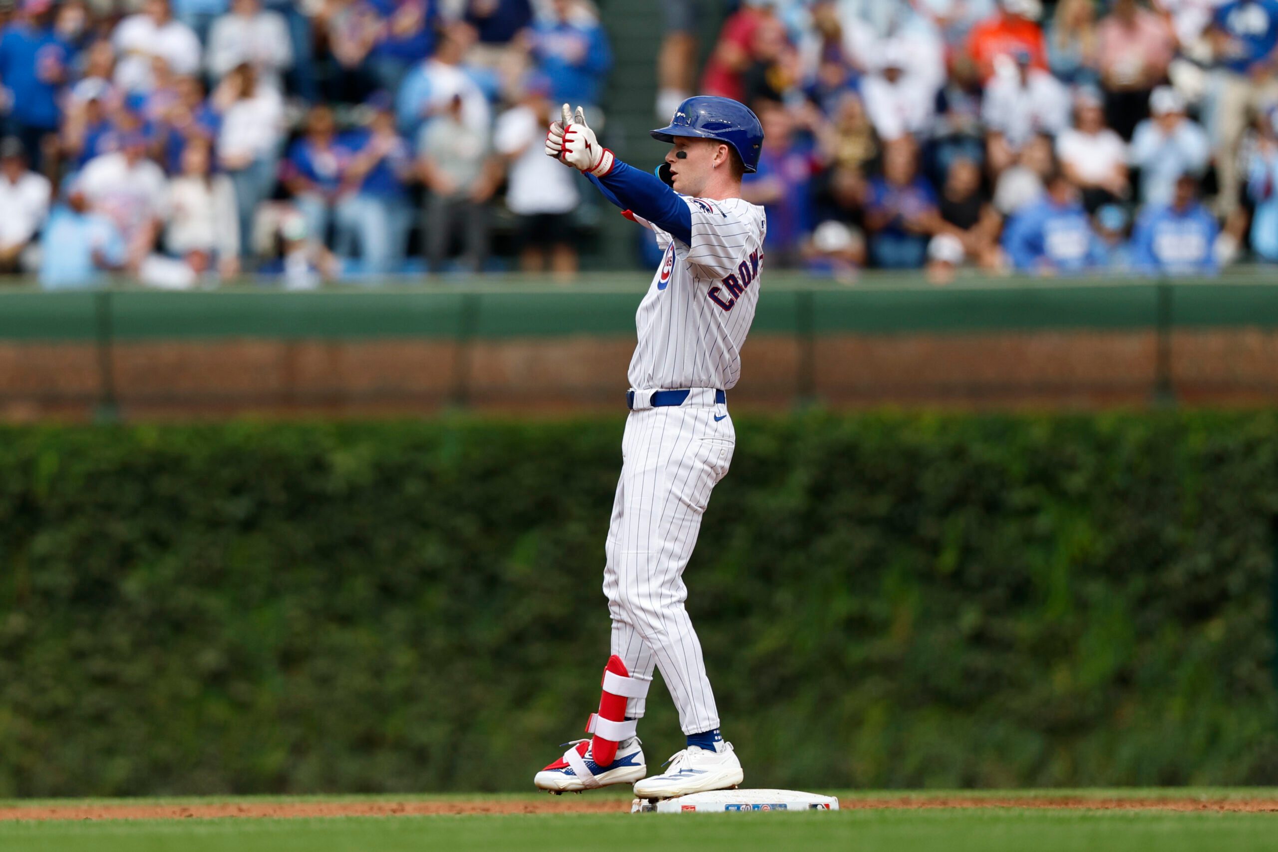 Sep 6, 2025; Chicago, Illinois, USA; Chicago Cubs left fielder Pete Crow-Armstrong (4) celebrates after hitting a double against the Washington Nationals during the second inning at Wrigley Field. Mandatory Credit: Kamil Krzaczynski-Imagn Images