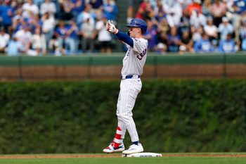 Sep 6, 2025; Chicago, Illinois, USA; Chicago Cubs left fielder Pete Crow-Armstrong (4) celebrates after hitting a double against the Washington Nationals during the second inning at Wrigley Field. Mandatory Credit: Kamil Krzaczynski-Imagn Images