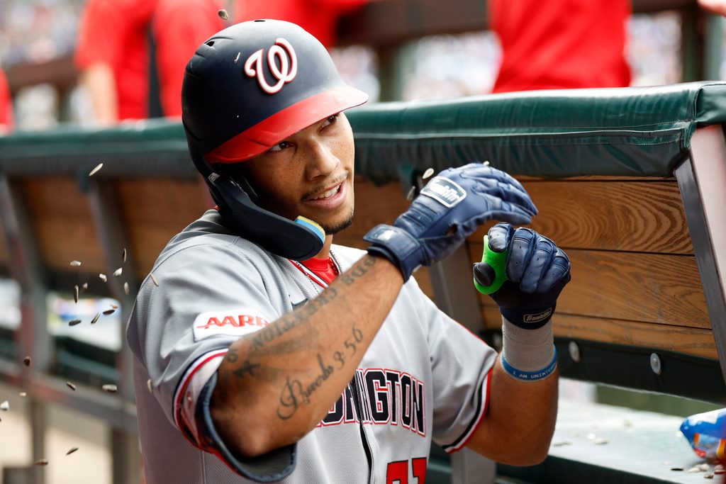 Sep 6, 2025; Chicago, Illinois, USA; Washington Nationals left fielder Daylen Lile (51) celebrates with teammates in the dugout after hitting a solo home run against the Chicago Cubs during the fourth inning at Wrigley Field. Mandatory Credit: Kamil Krzaczynski-Imagn Images