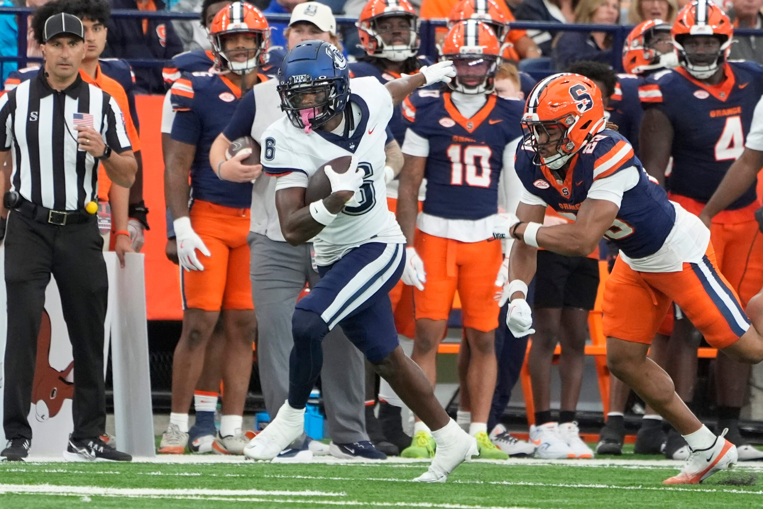 Sep 6, 2025; Syracuse, New York, USA; UConn Huskies wide receiver Reymello Murphy (6) runs after a catch against the Syracuse Orange during the second half at JMA Wireless Dome. Mandatory Credit: Gregory Fisher-Imagn Images