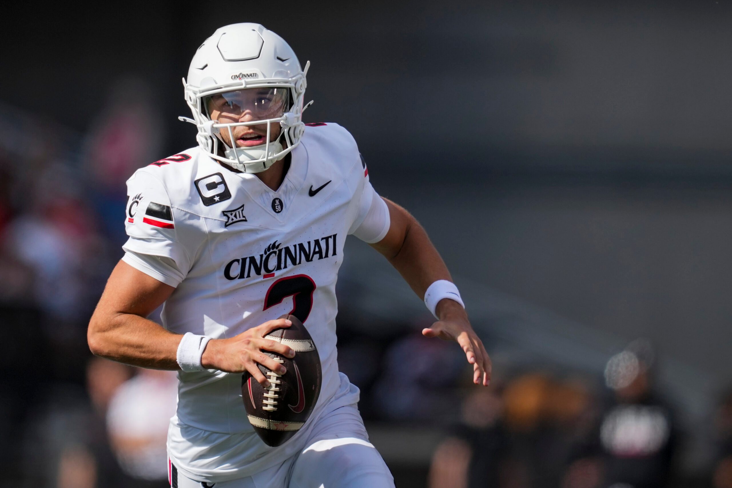 Sep 6, 2025; Cincinnati, Ohio, USA; Cincinnati Bearcats quarterback Brendan Sorsby (2) runs with the ball as he looks to pass against the Bowling Green Falcons in the first half at Nippert Stadium. Mandatory Credit: Aaron Doster-Imagn Images