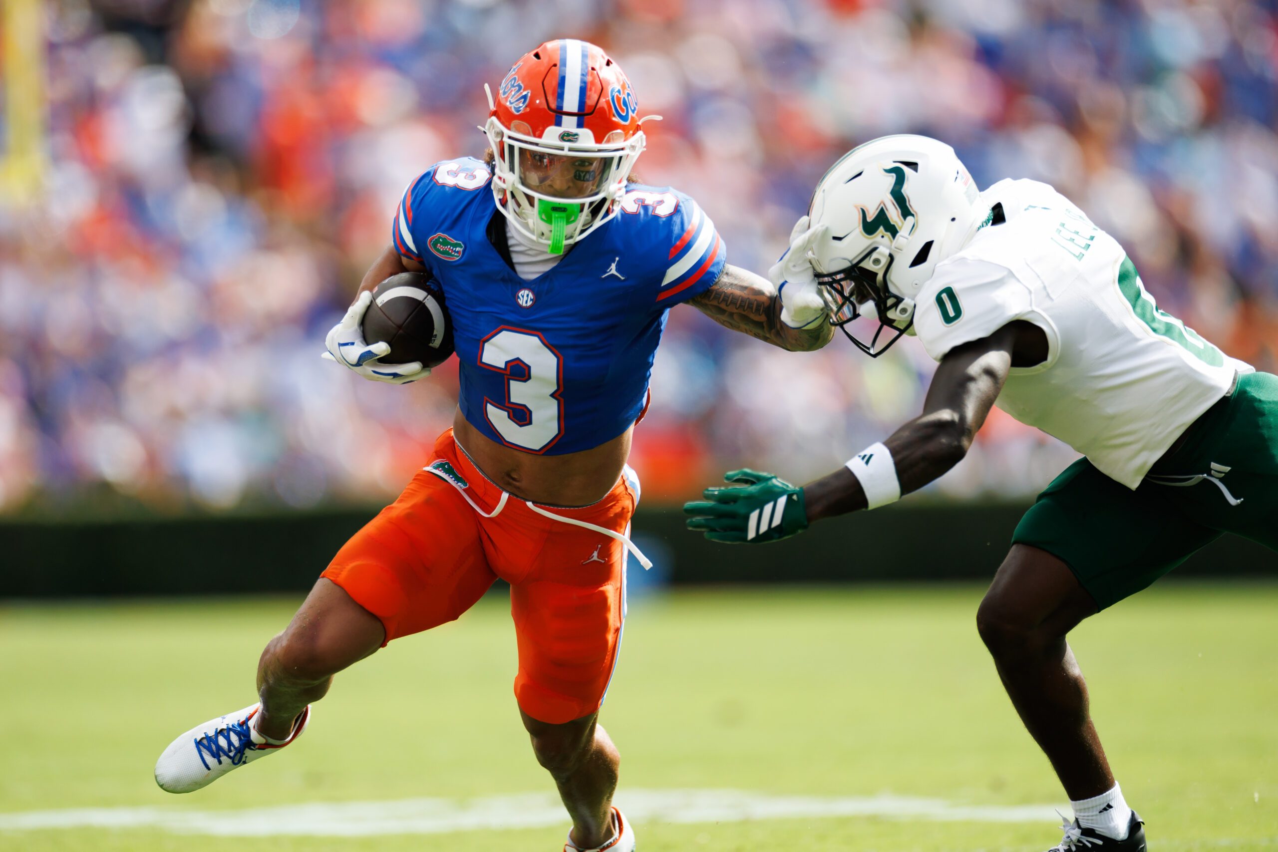 Sep 6, 2025; Gainesville, Florida, USA; Florida Gators wide receiver Eugene Wilson III (3) runs against South Florida Bulls cornerback Jarvis Lee (0) during the first half at Ben Hill Griffin Stadium. Mandatory Credit: Matt Pendleton-Imagn Images