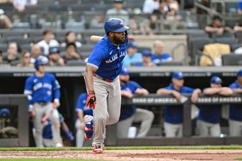 Sep 6, 2025; Bronx, New York, USA; Toronto Blue Jays first baseman Vladimir Guerrero Jr. (27) hits an infield single against the New York Yankees during the eighth inning at Yankee Stadium. Mandatory Credit: John Jones-Imagn Images