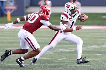 Sep 6, 2025; Little Rock, Arkansas, USA; Arkansas State Red Wolves quarterback Jaylen Raynor (1) rushes during the first quarter against the Arkansas Razorbacks at War Memorial Stadium. Mandatory Credit: Nelson Chenault-Imagn Images