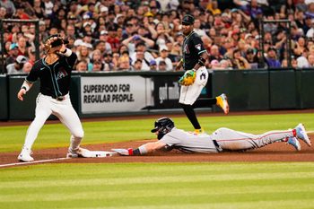Sep 6, 2025; Phoenix, Arizona, USA;  Boston Red Sox first base Romy Gonzalez (23) slides into third during the fourth inning between the Arizona Diamondbacks and the Boston Red Sox at Chase Field. Mandatory Credit: Arianna Grainey-Imagn Images