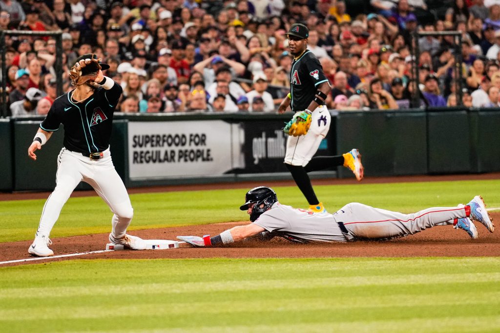 Sep 6, 2025; Phoenix, Arizona, USA; Boston Red Sox first base Romy Gonzalez (23) slides into third during the fourth inning between the Arizona Diamondbacks and the Boston Red Sox at Chase Field. Mandatory Credit: Arianna Grainey-Imagn Images