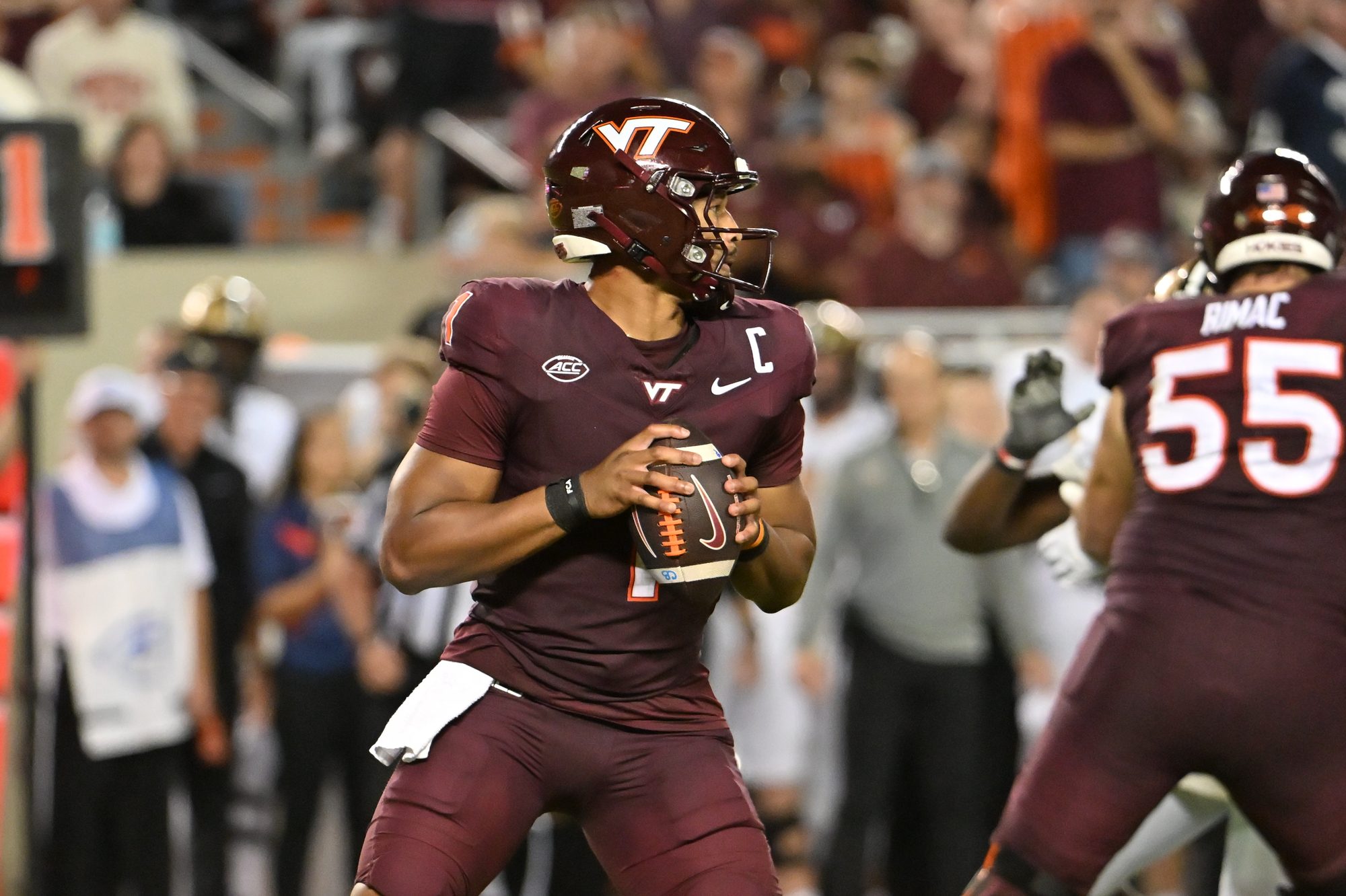 Sep 6, 2025; Blacksburg, Virginia, USA;  Virginia Tech Hokies quarterback Kyron Drones (1) looks to pass the ball during the fourth quarter at Lane Stadium. Mandatory Credit: Brian Bishop-Imagn Images