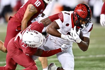 Sep 6, 2025; Pullman, Washington, USA; San Diego State Aztecs running back Lucky Sutton (7) is tackled by Washington State Cougars cornerback Colby Humphrey (2) in the second half at Gesa Field at Martin Stadium. Mandatory Credit: James Snook-Imagn Images