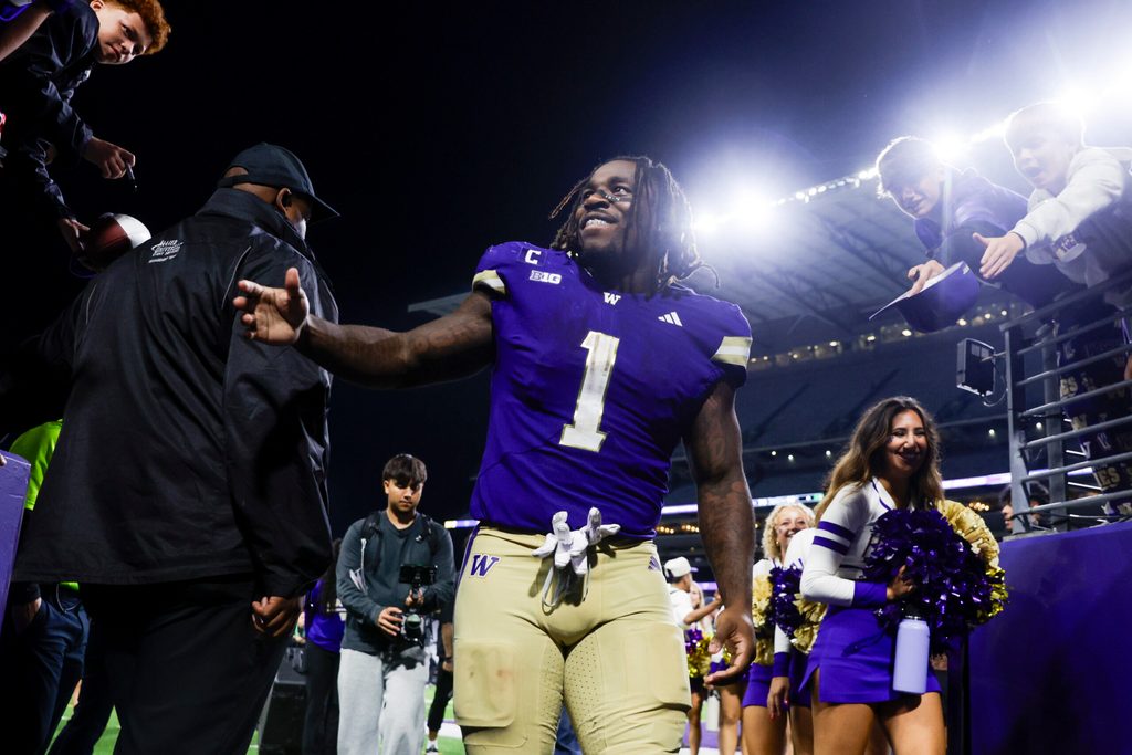 Sep 6, 2025; Seattle, Washington, USA; Washington Huskies running back Jonah Coleman (1) returns to the locker room following a victory against the UC Davis Aggies at Husky Stadium. Mandatory Credit: Joe Nicholson-Imagn Images