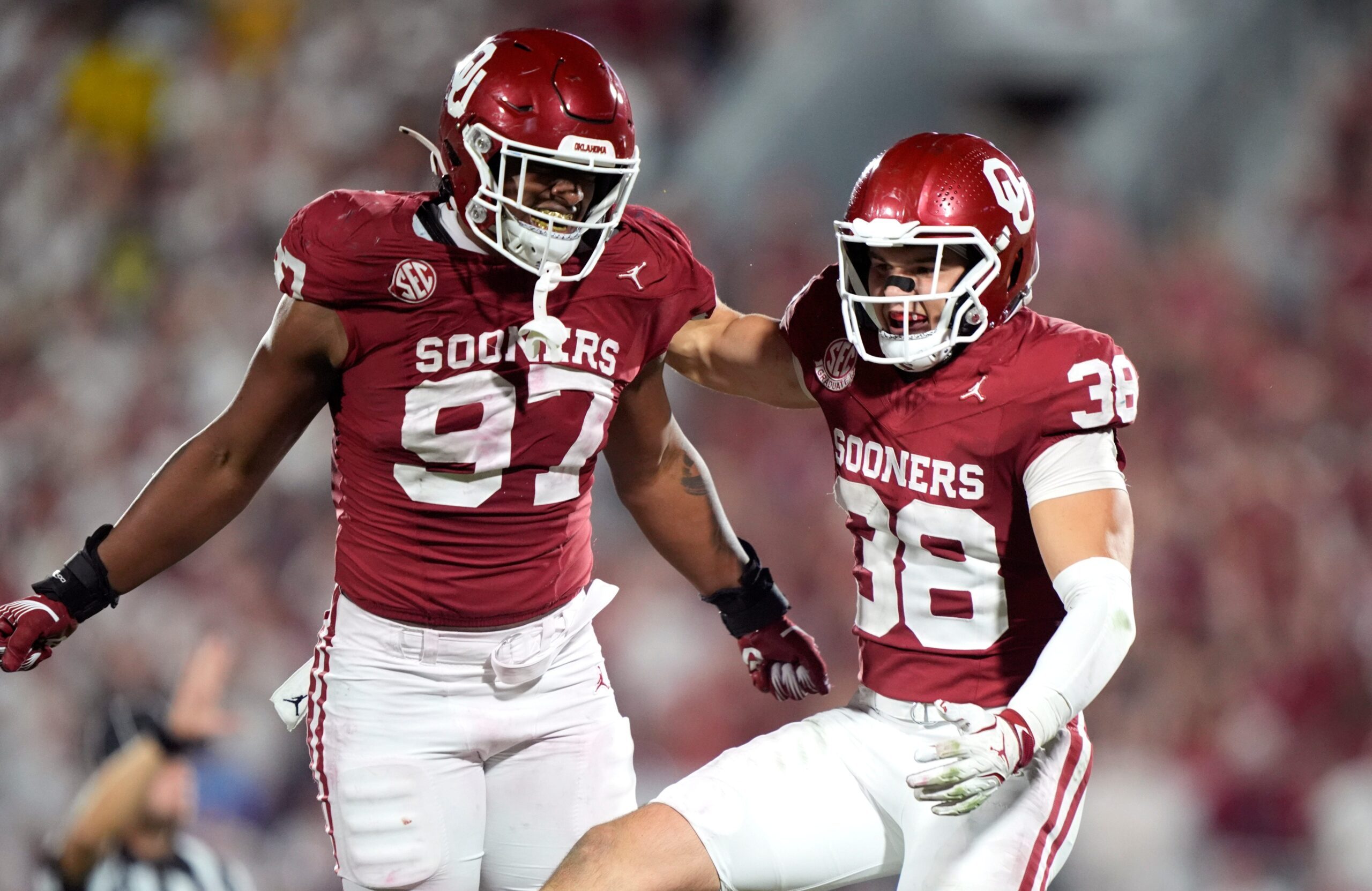 Oklahoma's Owen Heinecke (38) and Alex Shieldnight (97) celebrate in the second half of the college football game between the University of Oklahoma Sooner and the University of Michigan Wolverines at the Gaylord Family Ð Oklahoma Memorial Stadium in Norman, Okla., Saturday, Sept. 6, 2025.