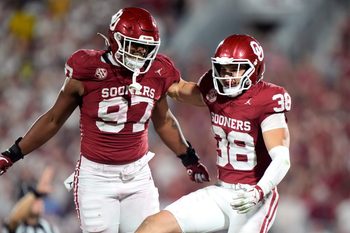 Oklahoma's Owen Heinecke (38) and Alex Shieldnight (97) celebrate in the second half of the college football game between the University of Oklahoma Sooner and the University of Michigan Wolverines at the Gaylord Family Ð Oklahoma Memorial Stadium in Norman, Okla., Saturday, Sept. 6, 2025.
