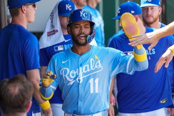 Sep 7, 2025; Kansas City, Missouri, USA; Kansas City Royals shortstop Maikel Garcia (11) celebrates in the dugout after scoring against the Minnesota Twins in the sixth inning at Kauffman Stadium. Mandatory Credit: Denny Medley-Imagn Images