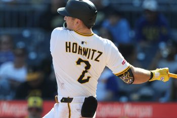 Sep 7, 2025; Pittsburgh, Pennsylvania, USA;  Pittsburgh Pirates first baseman Spencer Horwitz (2) hits a single against the Milwaukee Brewers during the eighth inning at PNC Park. Mandatory Credit: Charles LeClaire-Imagn Images