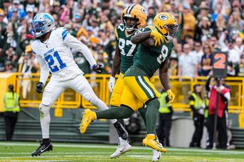 Green Bay Packers running back Josh Jacobs runs for a touchdown against Detroit Lions cornerback Amik Robertson during the second half at Lambeau Field in Green Bay, Wis., on Sunday, September 7, 2025.