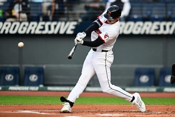 Sep 8, 2025; Cleveland, Ohio, USA; Cleveland Guardians designated hitter Kyle Manzardo (9) hits an RBI double against the Kansas City Royals during the first inning at Progressive Field. Mandatory Credit: Ken Blaze-Imagn Images