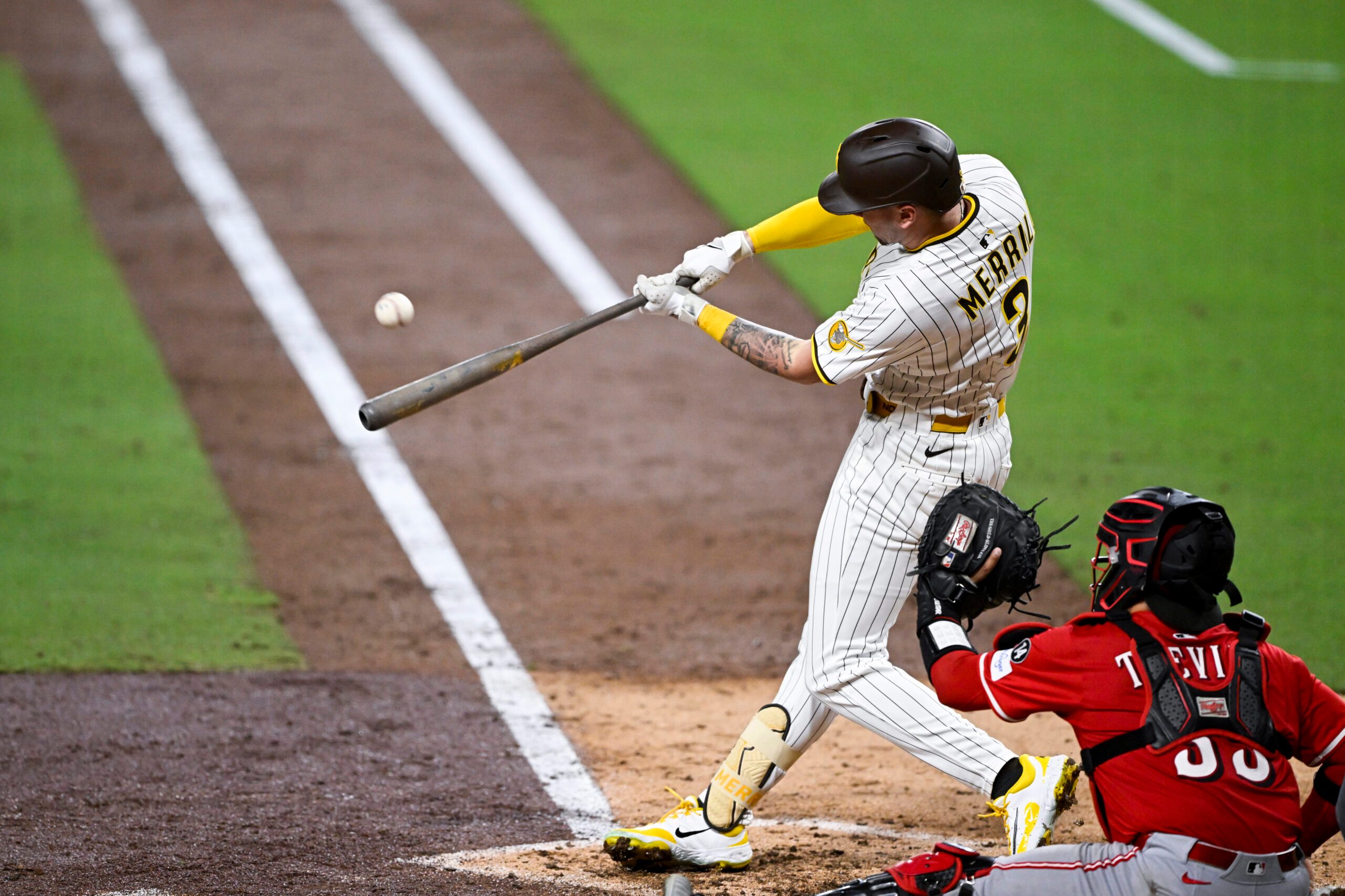 Sep 8, 2025; San Diego, California, USA; San Diego Padres center fielder Jackson Merrill (3) hits an RBI triple during the sixth inning against the Cincinnati Reds at Petco Park. Mandatory Credit: Denis Poroy-Imagn Images