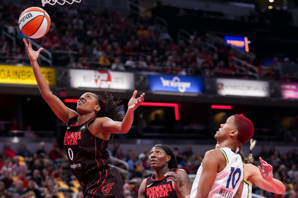 Indiana Fever guard Kelsey Mitchell (0) goes up for a basket Tuesday, Sept. 9, 2025, during a game between the Indiana Fever and the Minnesota Lynx at Gainbridge Fieldhouse in Indianapolis.