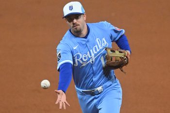 Sep 9, 2025; Cleveland, Ohio, USA; Kansas City Royals second baseman Nick Loftin (12) tosses the ball to first base in the seventh inning against the Cleveland Guardians at Progressive Field. Mandatory Credit: David Richard-Imagn Images