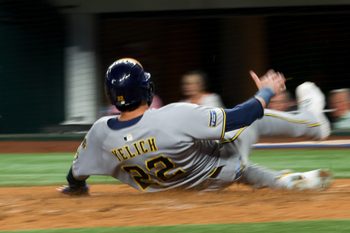 Sep 9, 2025; Arlington, Texas, USA;  (Editor's note: Slow shutter image.)  Milwaukee Brewers designated hitter Christian Yelich (22) scores during the fifth inning against the Texas Rangers at Globe Life Field. Mandatory Credit: Kevin Jairaj-Imagn Images