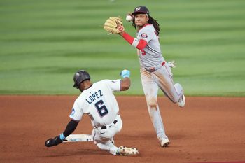 Sep 9, 2025; Miami, Florida, USA;  Washington Nationals shortstop CJ Abrams (5) completes a double play after getting the force out of Miami Marlins shortstop Otto Lopez (6) at second base in the seventh inning at loanDepot Park. Mandatory Credit: Jim Rassol-Imagn Images
