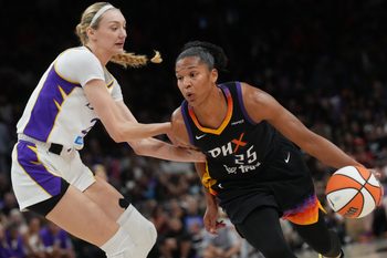 Phoenix Mercury forward Alyssa Thomas (25) drives past Los Angeles Sparks forward Cameron Brink (22) at PHX Arena on Sept. 9, 2025.
