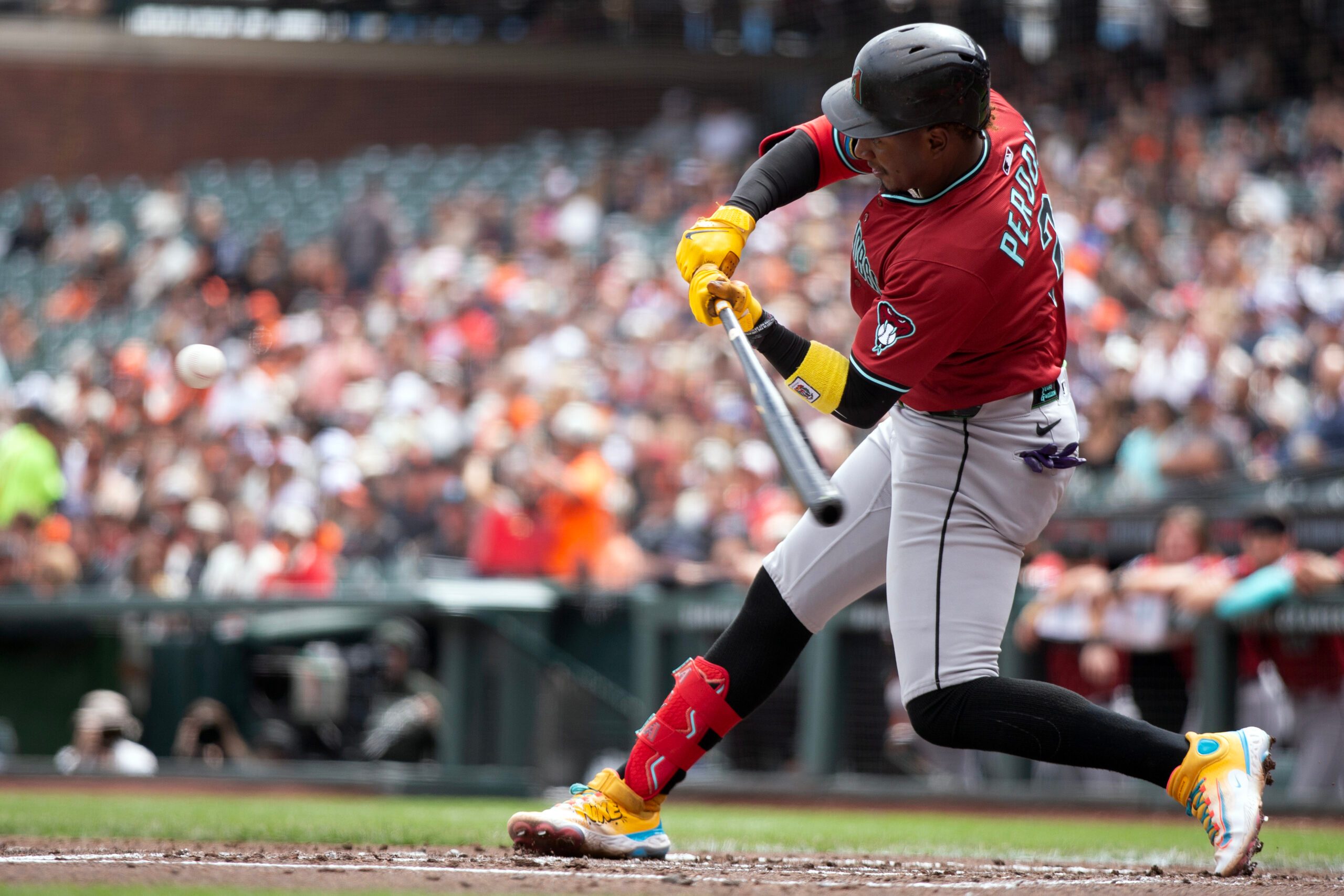 Sep 10, 2025; San Francisco, California, USA; Arizona Diamondbacks shortstop Geraldo Perdomo (2) connects for an RBI single against the San Francisco Giants during the second inning at Oracle Park. Mandatory Credit: D. Ross Cameron-Imagn Images