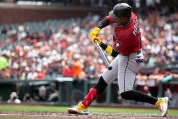 Sep 10, 2025; San Francisco, California, USA; Arizona Diamondbacks shortstop Geraldo Perdomo (2) connects for an RBI single against the San Francisco Giants during the second inning at Oracle Park. Mandatory Credit: D. Ross Cameron-Imagn Images