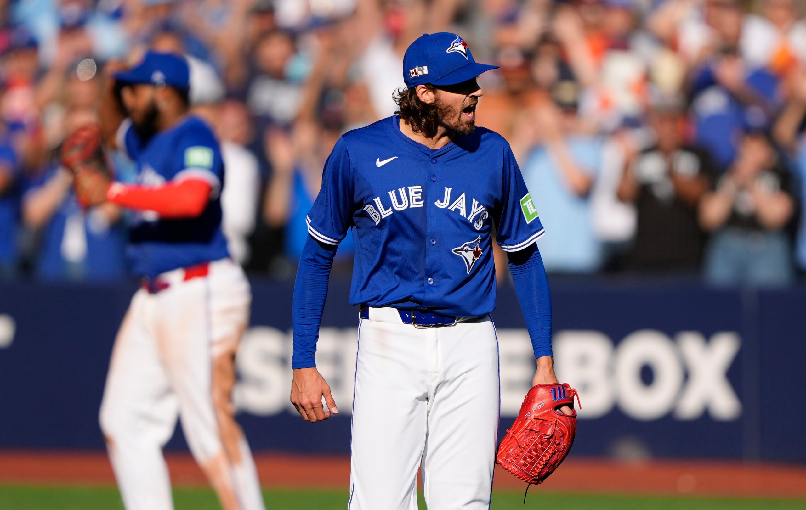 Sep 11, 2025; Toronto, Ontario, CAN; Toronto Blue Jays starting pitcher Kevin Gausman (34) reacts after a complete game win over the Houston Astros at Rogers Centre. Mandatory Credit: John E. Sokolowski-Imagn Images