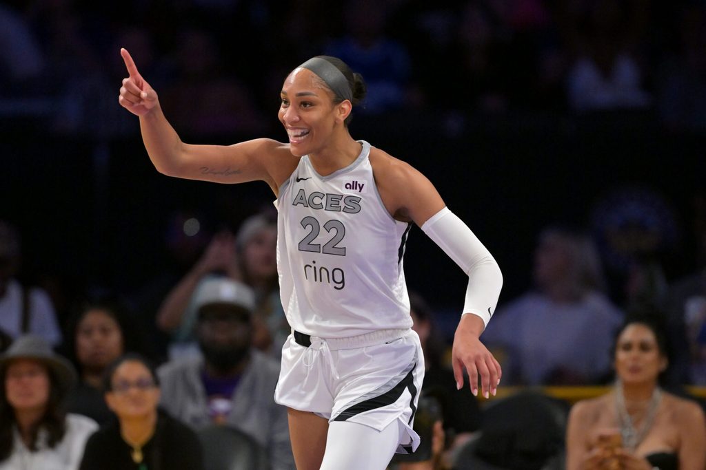 Sep 11, 2025; Los Angeles, California, USA; Las Vegas Aces center A'ja Wilson (22) celebrates after a 3 pointer during the second half against the Los Angeles Sparks at Crypto.com Arena. Mandatory Credit: Jayne Kamin-Oncea-Imagn Images