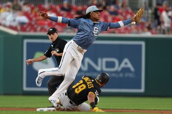 Sep 12, 2025; Washington, District of Columbia, USA; Pittsburgh Pirates second base Nick Gonzales (39) slides into second base as a throw by Washington Nationals first base Josh Bell (not pictured) on a ground ball by Pirates outfielder Oneil Cruz (not pictured) sails past Nationals shortstop CJ Abrams (5) during the second inning at Nationals Park. Mandatory Credit: Geoff Burke-Imagn Images