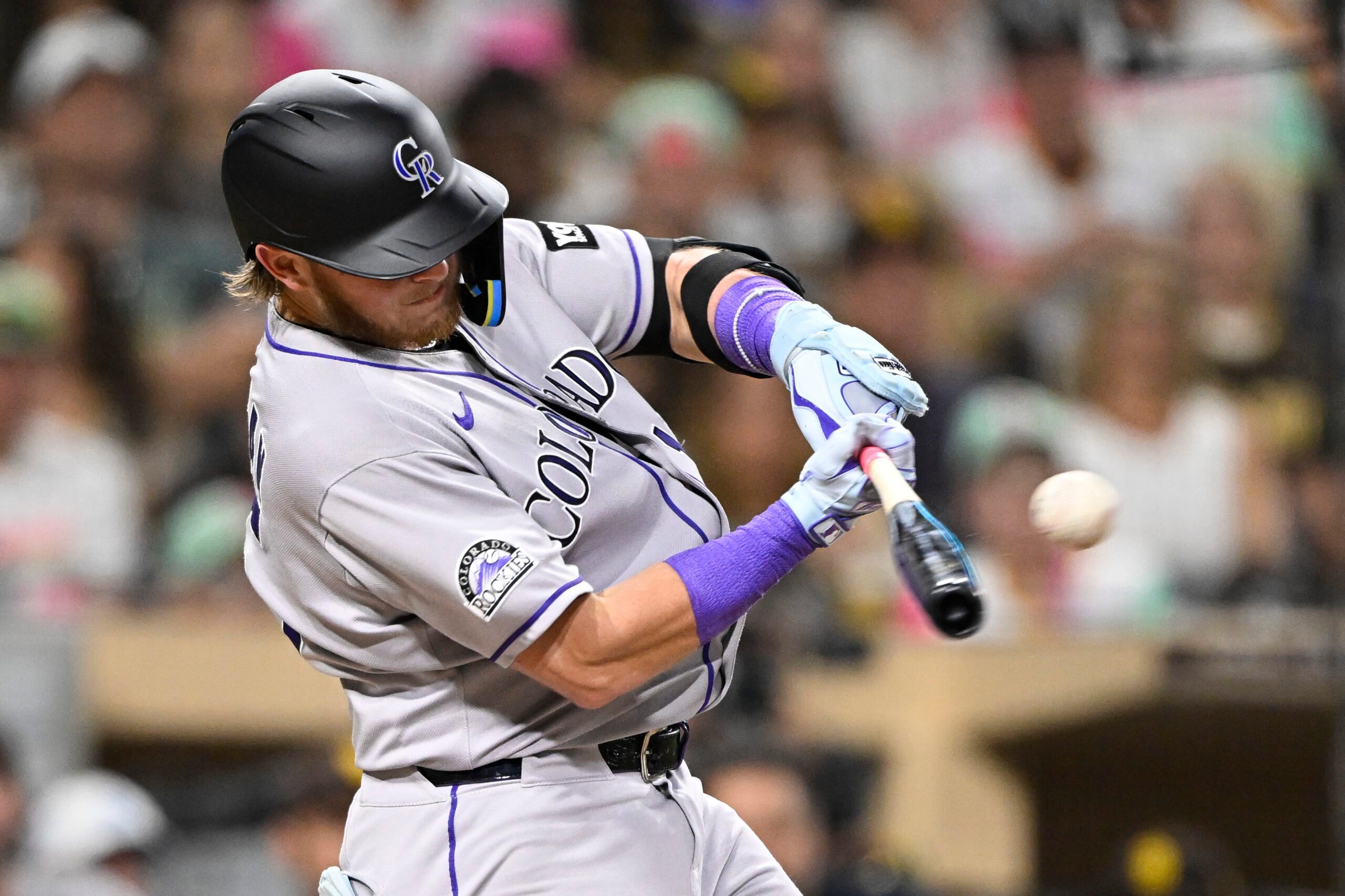 Sep 12, 2025; San Diego, California, USA; Colorado Rockies catcher Hunter Goodman (15) hits a single during the fourth inning against the San Diego Padres at Petco Park. Mandatory Credit: Denis Poroy-Imagn Images
