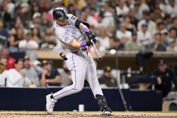 Sep 12, 2025; San Diego, California, USA; Colorado Rockies left fielder Jordan Beck (27) hits a single during the fourth inning against the San Diego Padres at Petco Park. Mandatory Credit: Denis Poroy-Imagn Images