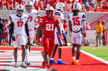 Sep 13, 2025; Lincoln, Nebraska, USA; Nebraska Cornhuskers running back Emmett Johnson (21) walks off after scoring against the Houston Christian Huskies during the second quarter at Memorial Stadium. Mandatory Credit: Dylan Widger-Imagn Images