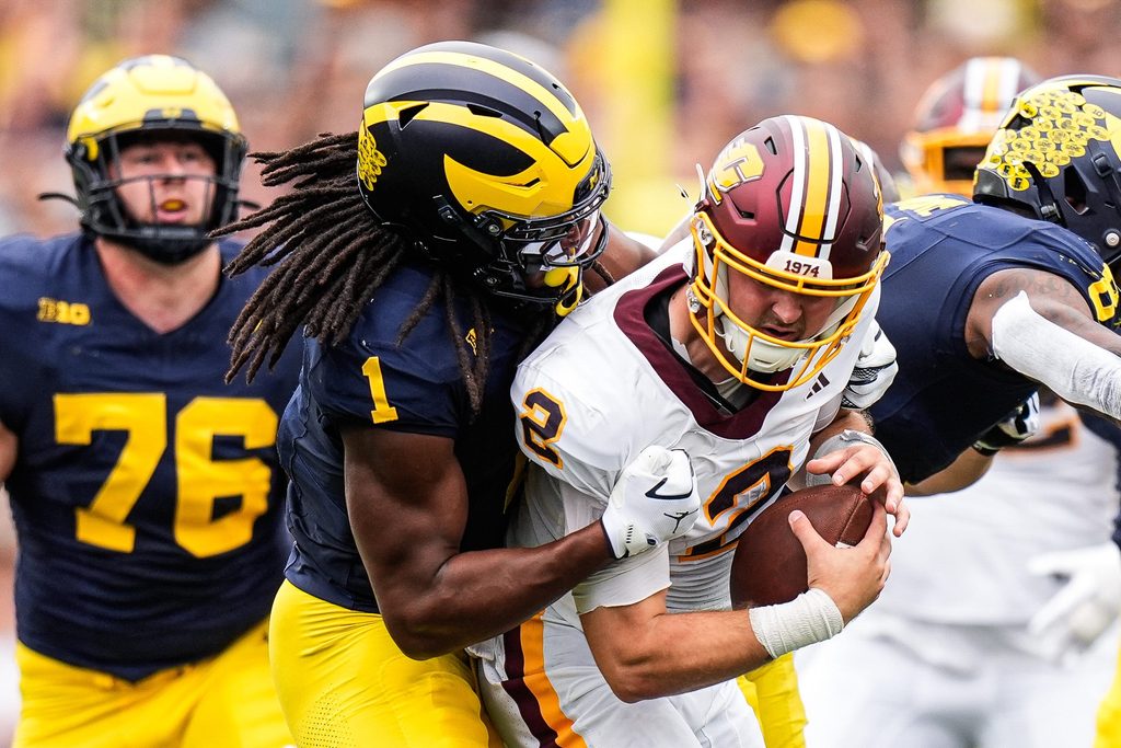 Michigan linebacker Jaishawn Barham (1) sacks Central Michigan quarterback Joe Labas (2) during the first half at Michigan Stadium in Ann Arbor on Saturday, Sept. 13, 2025.