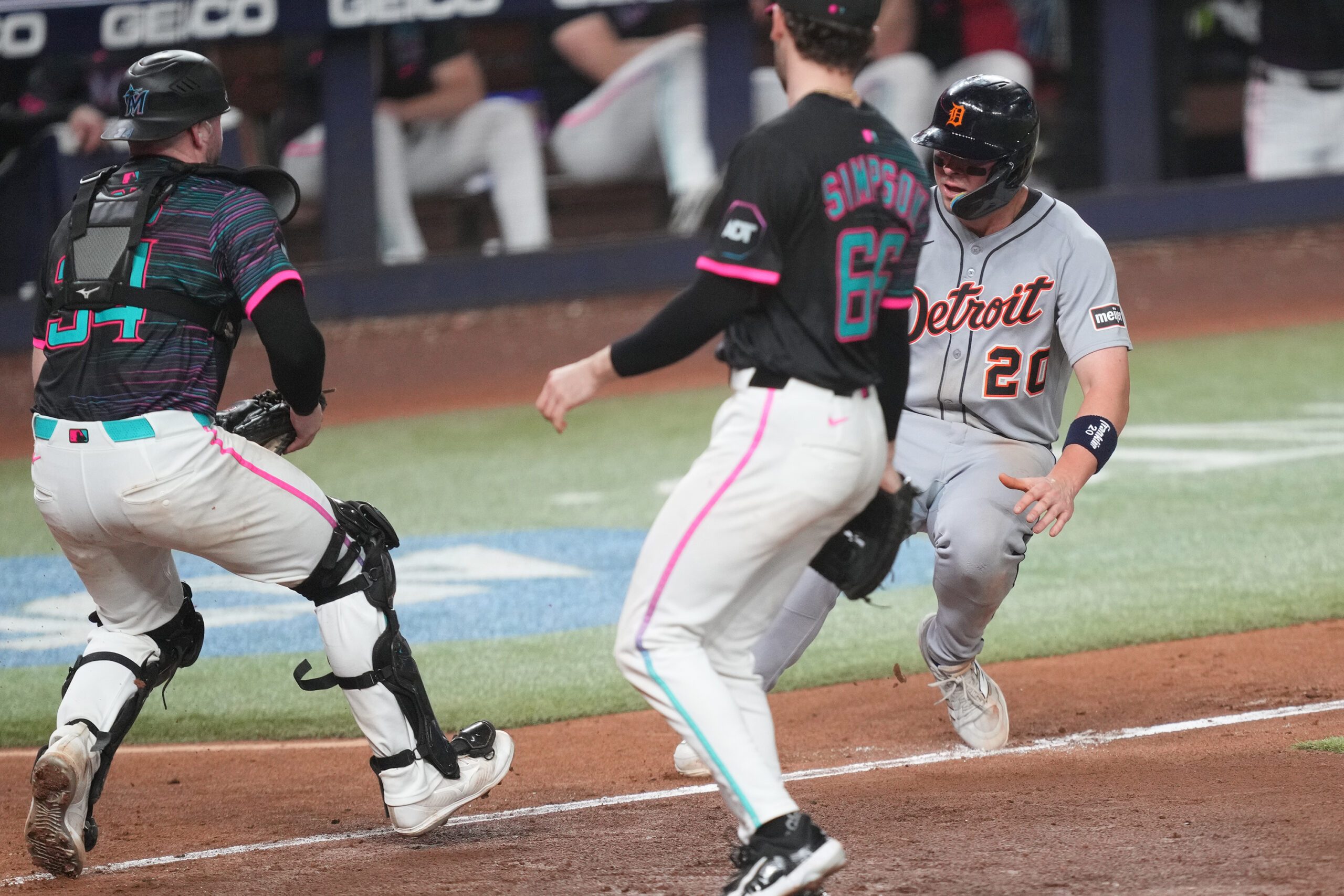 Sep 13, 2025; Miami, Florida, USA;  Miami Marlins catcher Liam Hicks (34) runs down Detroit Tigers first baseman Spencer Torkelson (20) at home plate in the 11th inning at loanDepot Park. Mandatory Credit: Jim Rassol-Imagn Images