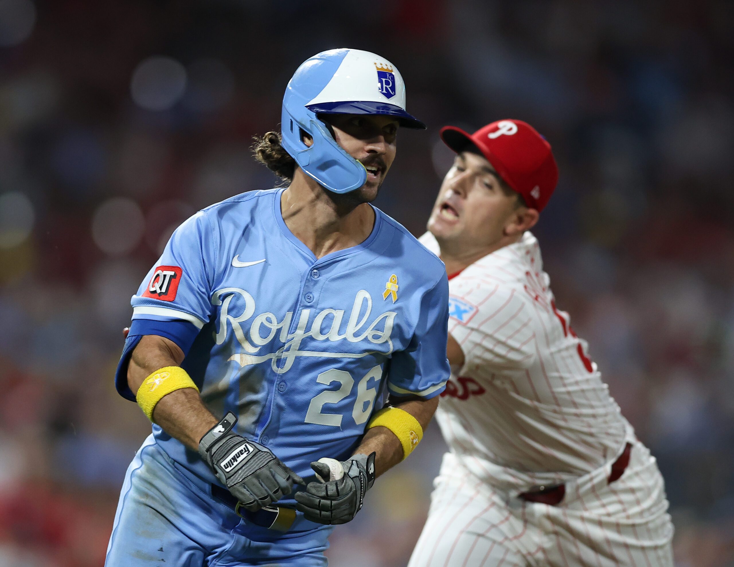 Sep 13, 2025; Philadelphia, Pennsylvania, USA; Philadelphia Phillies pitcher David Robertson (30) tags out Kansas City Royals second base Adam Frazier (26) during the seventh inning at Citizens Bank Park. Mandatory Credit: Bill Streicher-Imagn Images
