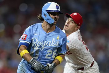 Sep 13, 2025; Philadelphia, Pennsylvania, USA; Philadelphia Phillies pitcher David Robertson (30) tags out Kansas City Royals second base Adam Frazier (26) during the seventh inning at Citizens Bank Park. Mandatory Credit: Bill Streicher-Imagn Images