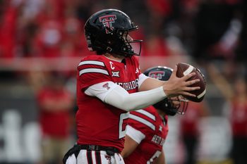 Sep 13, 2025; Lubbock, Texas, USA;  Texas Tech Red Raiders quarterback Behren Morton (2) takes a snap in the second half against the Oregon State Beavers at Jones AT&T Stadium. Mandatory Credit: Michael C. Johnson-Imagn Images